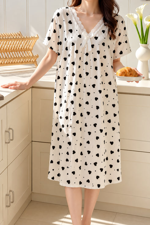 The Bow Edit Nightdress – Ivory Black Hearts; lace V-neck, white bow, short sleeves, hem just above mid-calf