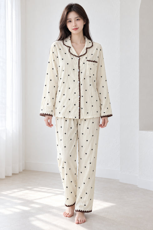 Moonlit Crochet-Trim Pyjama Set – Ivory Cocoa Bear; full-length portrait showing crochet-trim long-sleeve top and matching trousers