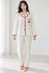 Moonlit Crochet-Trim Pyjama Set – Ivory Red Penguin; full-length portrait showing crochet-trim long-sleeve top and matching trousers