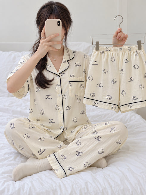 Sunday Club Three-Piece Lounge Set – Ivory Kitty; short-sleeve button-front top, matching trousers and shorts