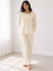 MNM29 Print 5 ivory daisy full sleeve pyjama set worn by an Indian model in a minimal white room