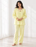 MNM29 Print 9 pale lemon teddy embroidery full sleeve pyjama set worn by an Indian model in a minimal white room